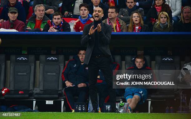 Bayern Munich's Spanish head coach Pep Guardiola reacts during the UEFA Champions League second-leg semi-final football match FC Bayern Munich vs...