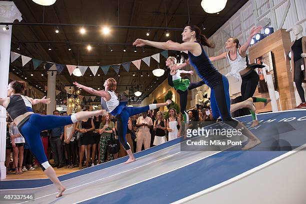 Models perform during the Derek Lam 10C Athleta launch party at the Athleta Flagship store on September 8, 2015 in New York City.