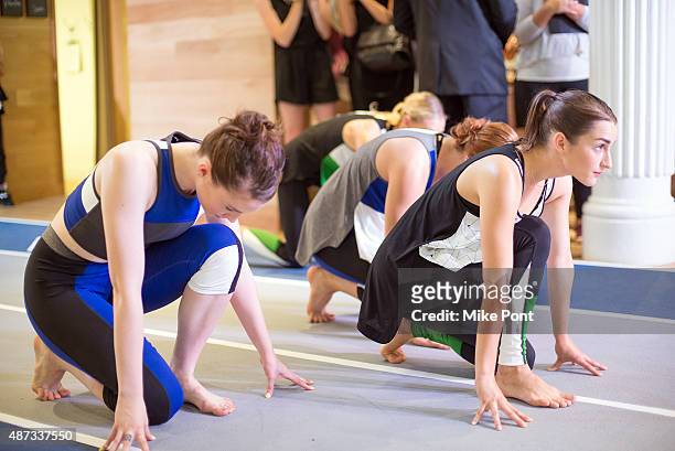 Models perform during the Derek Lam 10C Athleta launch party at the Athleta Flagship store on September 8, 2015 in New York City.