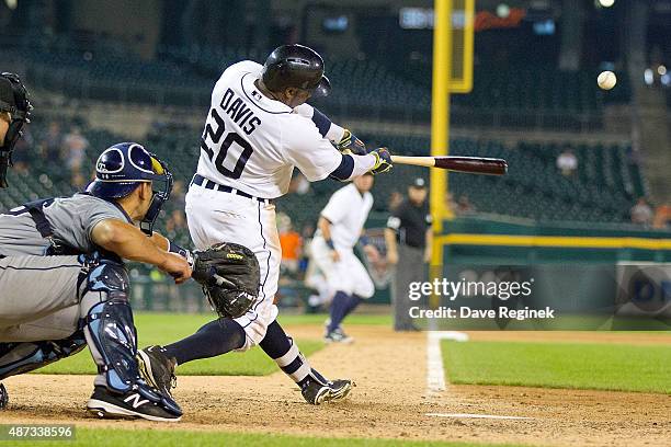 Rajai Davis of the Detroit Tigers hits a sacrifice fly in the thirteenth inning to drive in the winning run to defeat the Tampa Bay Rays 8-7 during a...