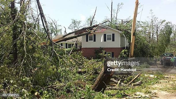 In this handout provided by the Mississippi National Guard, Mississippi National Guard members respond in a community following a deadly tornado...