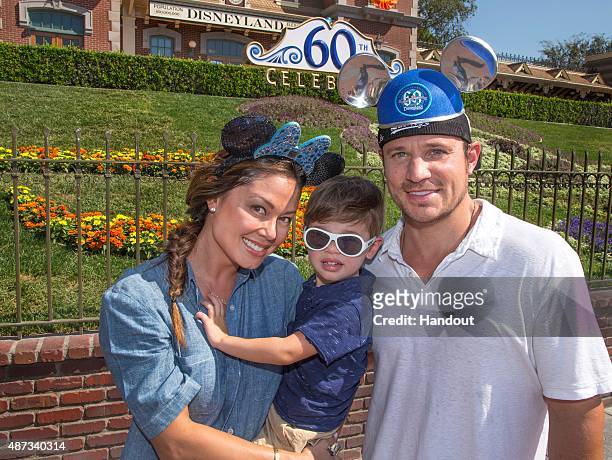 In this handout photo provided by Disney Parks, Vanessa Lachey, Camden Lachey and singer/tv personality Nick Lachey visit Disneyland on September 08,...