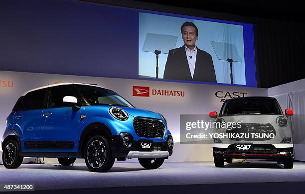 Masanori Mitsui, president of Japanese automaker Daihatsu, a subsidiary of Toyota Motor introduces the company's compact wagon "Cast" in Tokyo on...