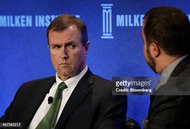 Cliff Noreen, president of Babson Capital Management LLC, left, listens during the annual Milken Institute Global Conference in Beverly Hills,...