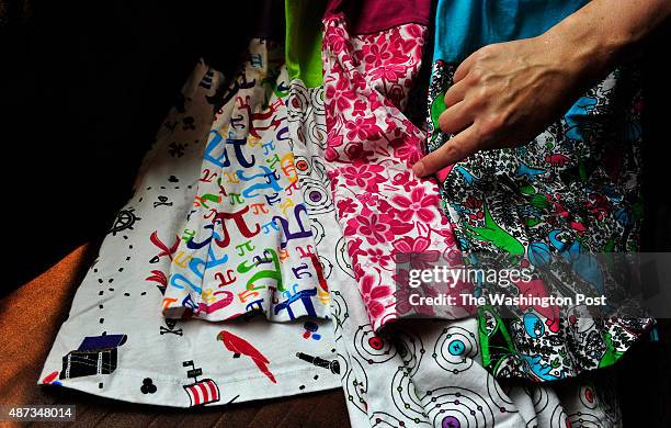 Rebecca Melsky points to a subtle Ninja character in the pattern of a dress. This set of dresses include patterns with a pirate motif, the Pi sign,...