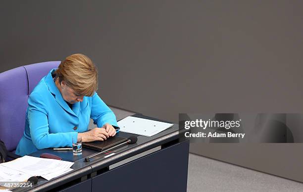 German Chancellor Angela Merkel pauses during a session of the Bundestag, the German parliament, on September 9, 2015 in Berlin, Germany. Merkel...