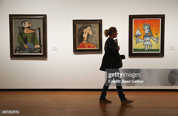 Visitor walks past paintings by Pablo Picasso during a preview for foreign journalists at the "Von Hockney bis Holbein, die Sammlung Würth"...