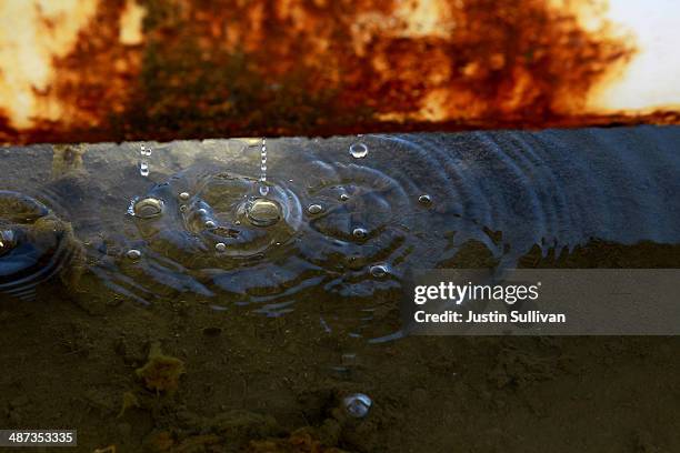 Water drips from an irrigation pipe at a farm on April 29, 2014 near Mendota, California. As the California drought continues, Central California...