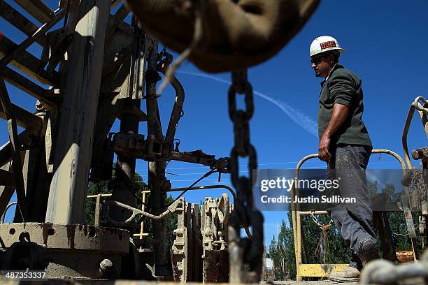 Jose Marquez with Arthur & Orum Well Drilling monitors a new well being drilled at a farm on April 29, 2014 near Mendota, California. As the...