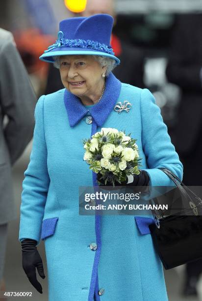 Britain's Queen Elizabeth II is pictured as she arives at Waverley Station in Edinburgh, Scotland, on September 9, 2015. Westminster Abbey's bells...