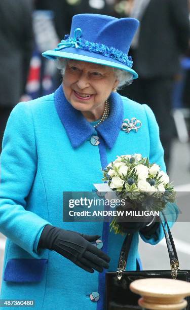 Britain's Queen Elizabeth II is pictured as she arrives at Waverley Station in Edinburgh, Scotland, on September 9, 2015. Westminster Abbey's bells...