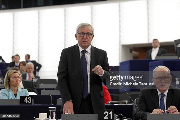 The European Commission's President Jean-Claude Juncker speaks in the plenary room between Vice-President Frans Timmermans and Federica Mogherini...