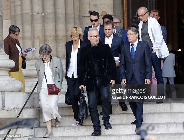 French fashion designer Jean-Paul Gaultier french journalist Fabien Lecoeuvre and swiss actress Anne Richard (background leave the funeral ceremony...