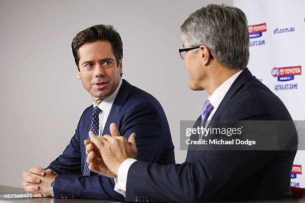 New AFL CEO Gillon McLachlan is clapped by Commission Chairman Mike Fitzpatrick speak to the media during an AFL press conference at AFL House on...