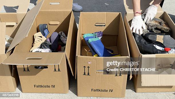 Donated shoes are pictured at the "Bayernkaserne", where donations for migrants have been collected, in Munich, southern Germany, on September 9,...