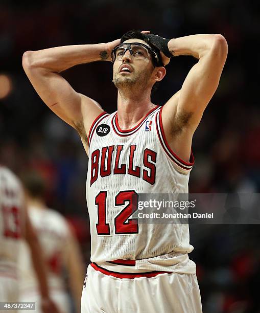 Kirk Hinrich of the Chicago Bulls reacts after fouling out at the end of the fourth quarter against the Washington Wizards in Game Five of the...