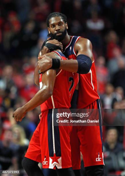 Nene of the Washington Wizards hugs teammate John Wall at the end of the game against the Chicago Bulls in Game Five of the Eastern Conference...