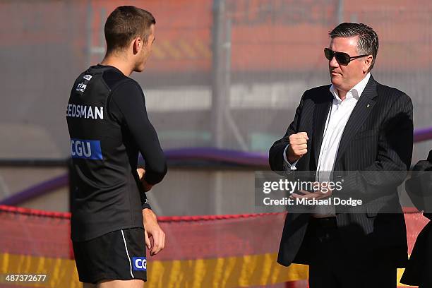 President Eddie McGuire talks to Paul Seedsman during a Collingwood Magpies AFL training session at the Westpac Centre on April 30, 2014 in...