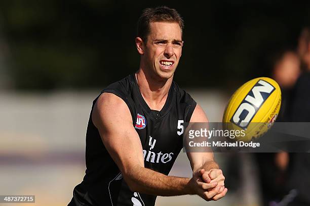 Nick Maxwell handpasses the ball during a Collingwood Magpies AFL training session at the Westpac Centre on April 30, 2014 in Melbourne, Australia.