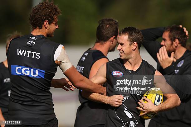 Nick Maxwell reacts when being grabbed by Jarrod Witts during a Collingwood Magpies AFL training session at the Westpac Centre on April 30, 2014 in...