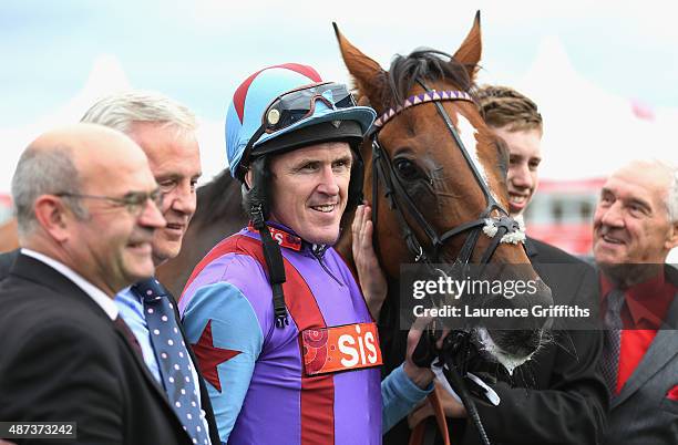 Gannicus and A. P. McCoy pose for a picture after victory in the Clipper Logistics Leger Legends Stakes at Doncaster Racecourse on September 9, 2015...