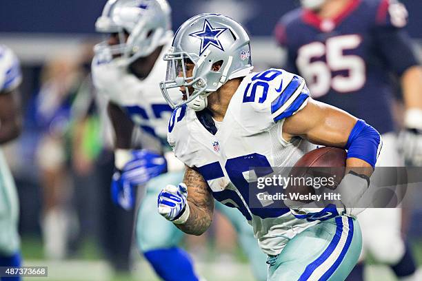 Keith Smith of the Dallas Cowboys runs the ball after recovering a fumble during a preseason game against the Houston Texans at AT&T Stadium on...