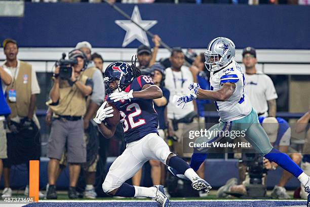 Keshawn Martin of the Houston Texans catches a touchdown pass during a preseason game against Byron Jones of the Dallas Cowboys at AT&T Stadium on...