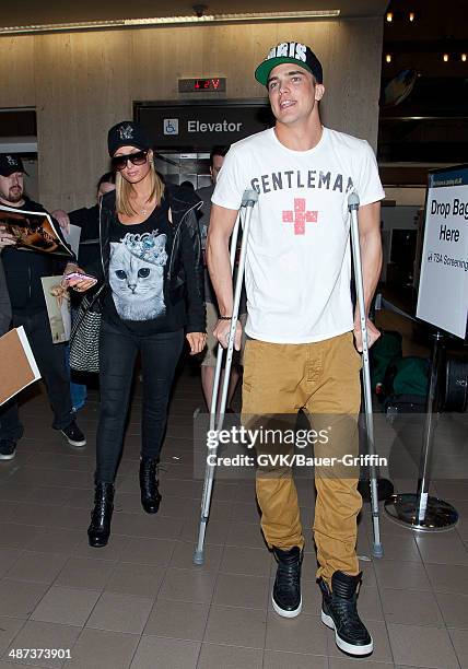 Paris Hilton and her boyfriend River Viiperi are seen at Los Angeles International Airport on February 17, 2013 in Los Angeles, California.