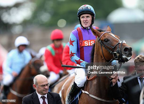 McCoy riding Gannicus make their way into the winners enclosure after victory in the Clipper Logistics Leger Legends Stakes at Doncaster Racecourse...