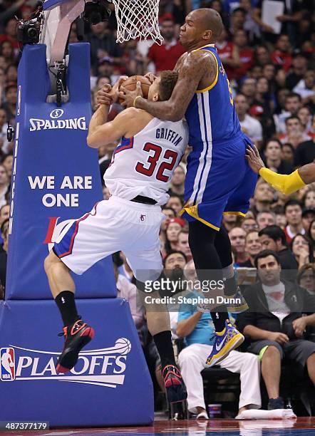 Marreese Speights of the Golden State Warriors commits a flagrant foul against Blake Griffin of the Los Angeles Clippers in Game Five of the Western...