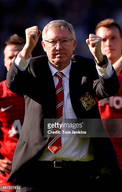Sir Alex Ferguson gestures to the United fans after the West Bromwich Albion versus Manchester United FA Premier League match, the final match for...