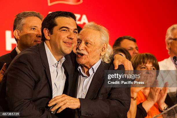 Alexis Tsipras, leader of Syriza in Greece, hugs Manolis Glezos, the flagship member of Syriza, when presenting the ballot for the EU Parliamentary...