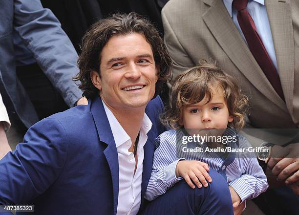 Actor Orlando Bloom and his son Flynn Bloom attend the ceremony honoring Orlando Bloom with a Star on The Hollywood Walk of Fame on April 2, 2014 in...