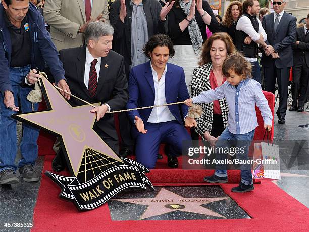 Actor Orlando Bloom and his son Flynn Bloom attend the ceremony honoring Orlando Bloom with a Star on The Hollywood Walk of Fame on April 2, 2014 in...