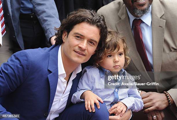 Actor Orlando Bloom and his son Flynn Bloom attend the ceremony honoring Orlando Bloom with a Star on The Hollywood Walk of Fame on April 2, 2014 in...