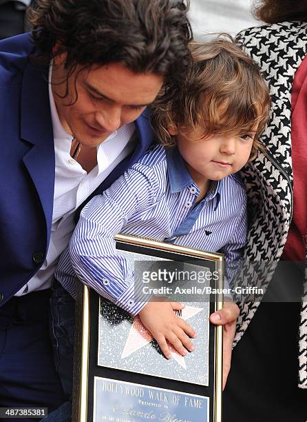 Actor Orlando Bloom and his son Flynn Bloom attend the ceremony honoring Orlando Bloom with a Star on The Hollywood Walk of Fame on April 2, 2014 in...