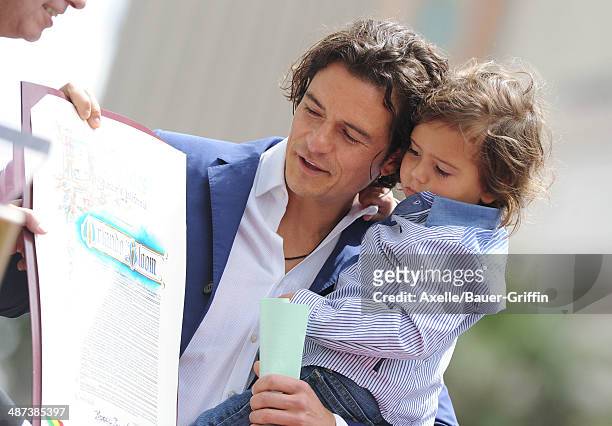 Actor Orlando Bloom and his son Flynn Bloom attend the ceremony honoring Orlando Bloom with a Star on The Hollywood Walk of Fame on April 2, 2014 in...