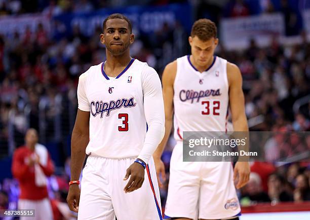 Chris Paul and Blake Griffin of the Los Angeles Clippers walk onto the floor after a time out against the Golden State Warriors in Game Five of the...