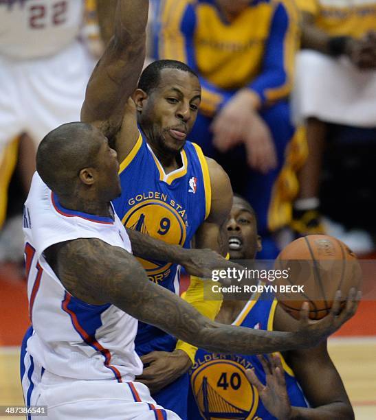 Los Angeles Clippers Jamal Crawford drives to the basket against Golden State Warriors Andre Iguodala during the NBA playoff game 5 between the Los...