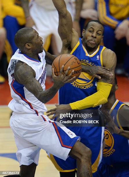 Los Angeles Clippers Jamal Crawford drives to the basket against Golden State Warriors Andre Iguodala during the NBA playoff game 5 between the Los...