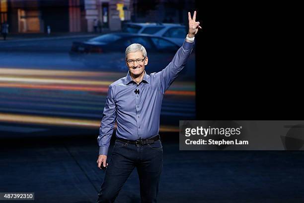 Apple CEO Tim Cook waves as he arrives on stage during an Apple Special Event on at Bill Graham Civic Auditorium September 9, 2015 in San Francisco,...