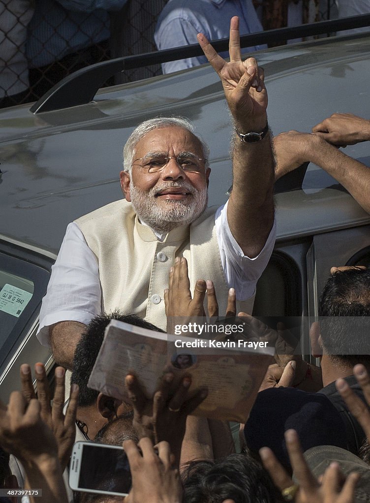 BJP Leader Narendra Modi Shows His Inked Finger To Supporters As He bjp-leader-narendra-modi-shows-his-inked-finger-to-supporters-as-he