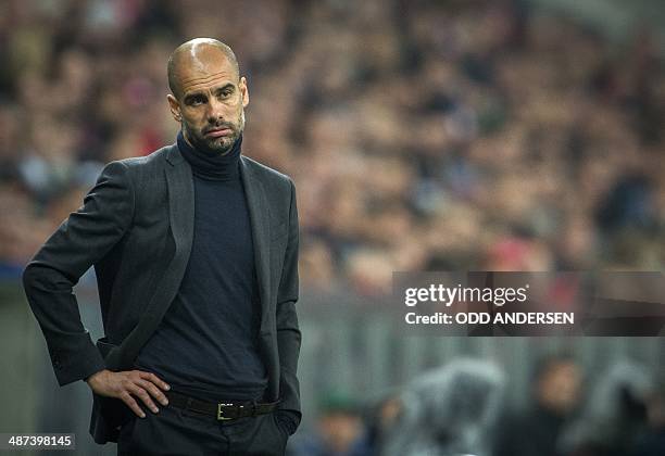 Bayern Munich's Spanish head coach Pep Guardiola reacts during the Champions League 2nd leg semi-final football match between Bayern Munich and Real...