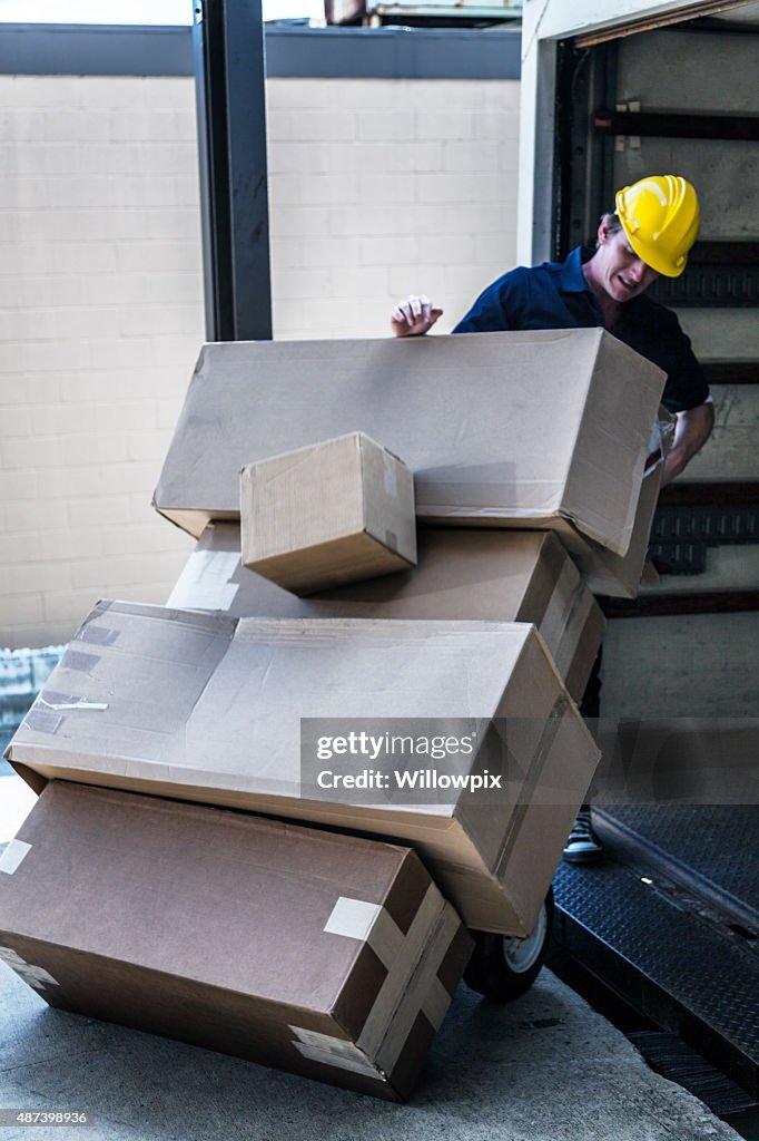 Falling Box On Racking Falling Boxes Loading Dock Delivery Truck Worker High-Res Stock Photo ...