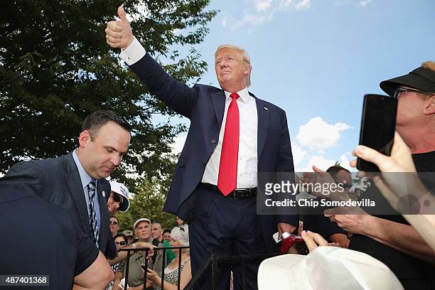 Republican presidential candidate Donald Trump acknowledges supporters after addressing a rally against the Iran nuclear deal on the West Lawn of the...