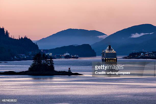 ms westerdam sailing into ketchikan at dawn - revillagigedo island alaska stockfoto's en -beelden