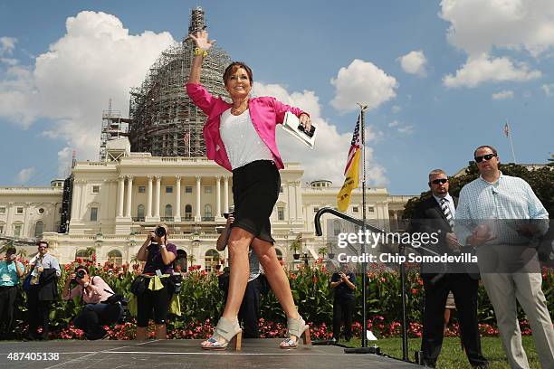 Former vice presidential candidate Sarah Palin takes the stage during a rally against the Iran nuclear deal on the West Lawn of the U.S. Capitol...