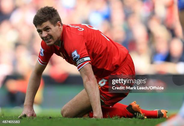 Steven Gerrard of Liverpool looks dejected during the Barclays Premier League match between Liverpool and Chelsea at Anfield on April 27, 2014 in...