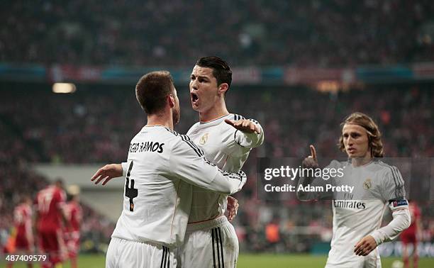 Sergio Ramos of Real Madrid is congratulated by Cristiano Ronaldo after scoring the first goal during the UEFA Champions League semi-final second leg...