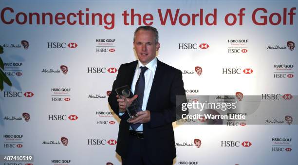 Tony Judge, Chief Executive of ClubstoHire.com poses with the inaugural HSBC Golf Business Community Innovation Award during the HSBC Golf Business...